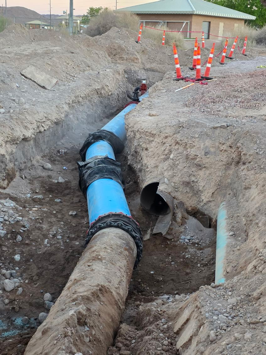 The point where the newly installed 24” water main replaces an old faulty segment of pipeline in a $2.4 million MVWD project through the Moapa/Glendale area.